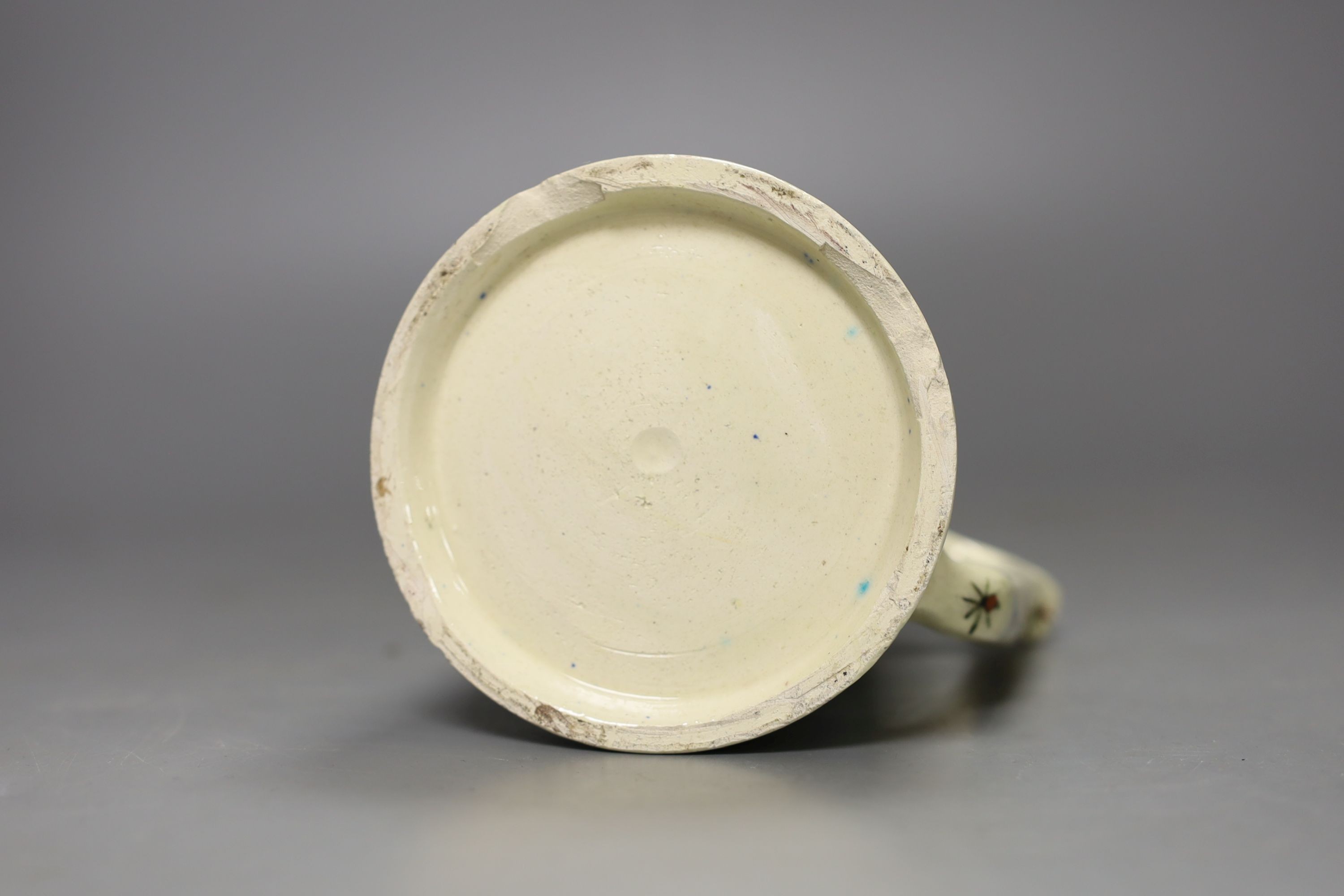 A Turkish Kutahya earthenware tapering mug, 12.5 cm high